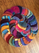 rainbow circle of crocheted hats